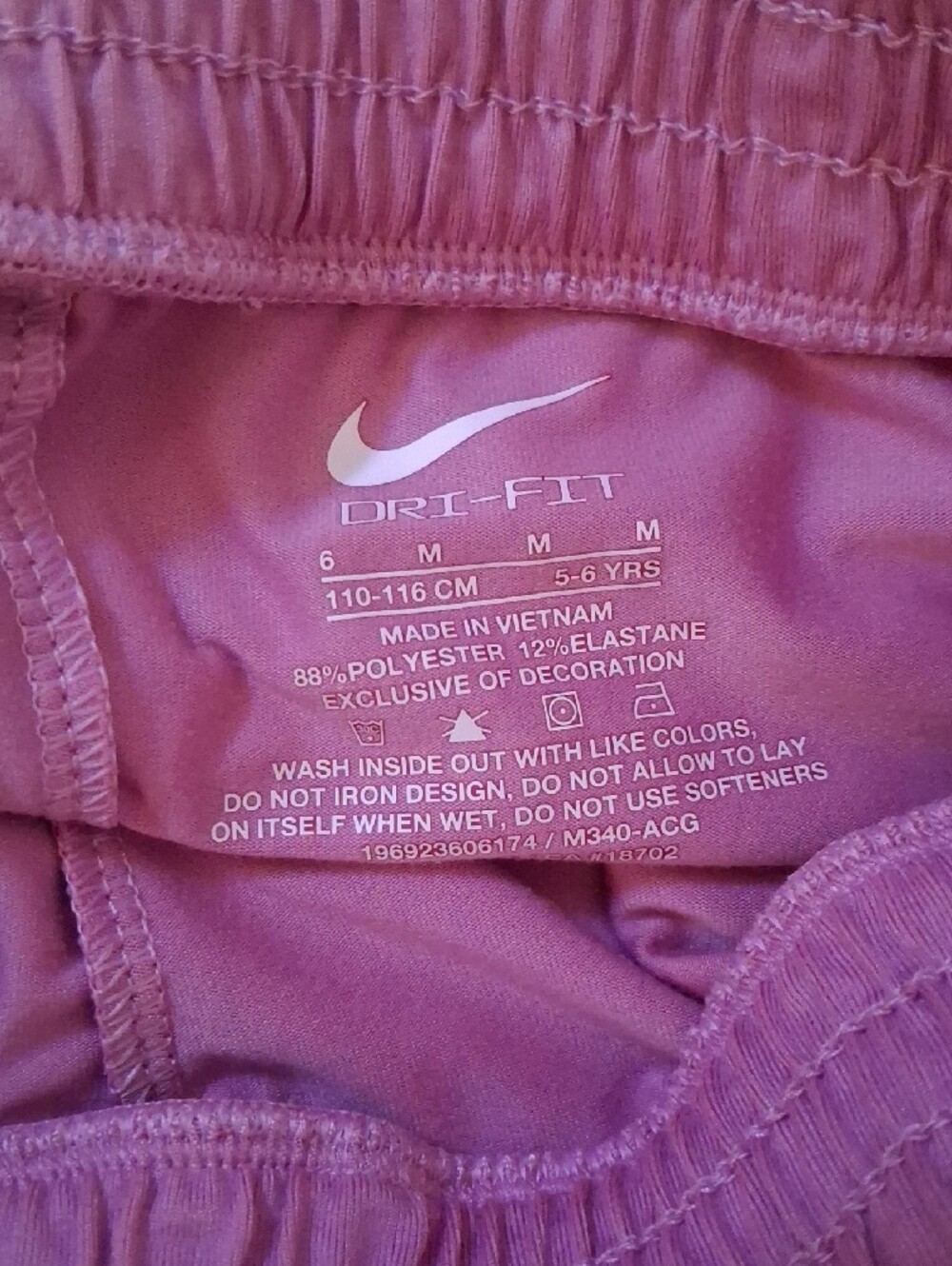 Nike Pink Athletic Flared Running Shorts with White Swoosh - Picture 3 of 4